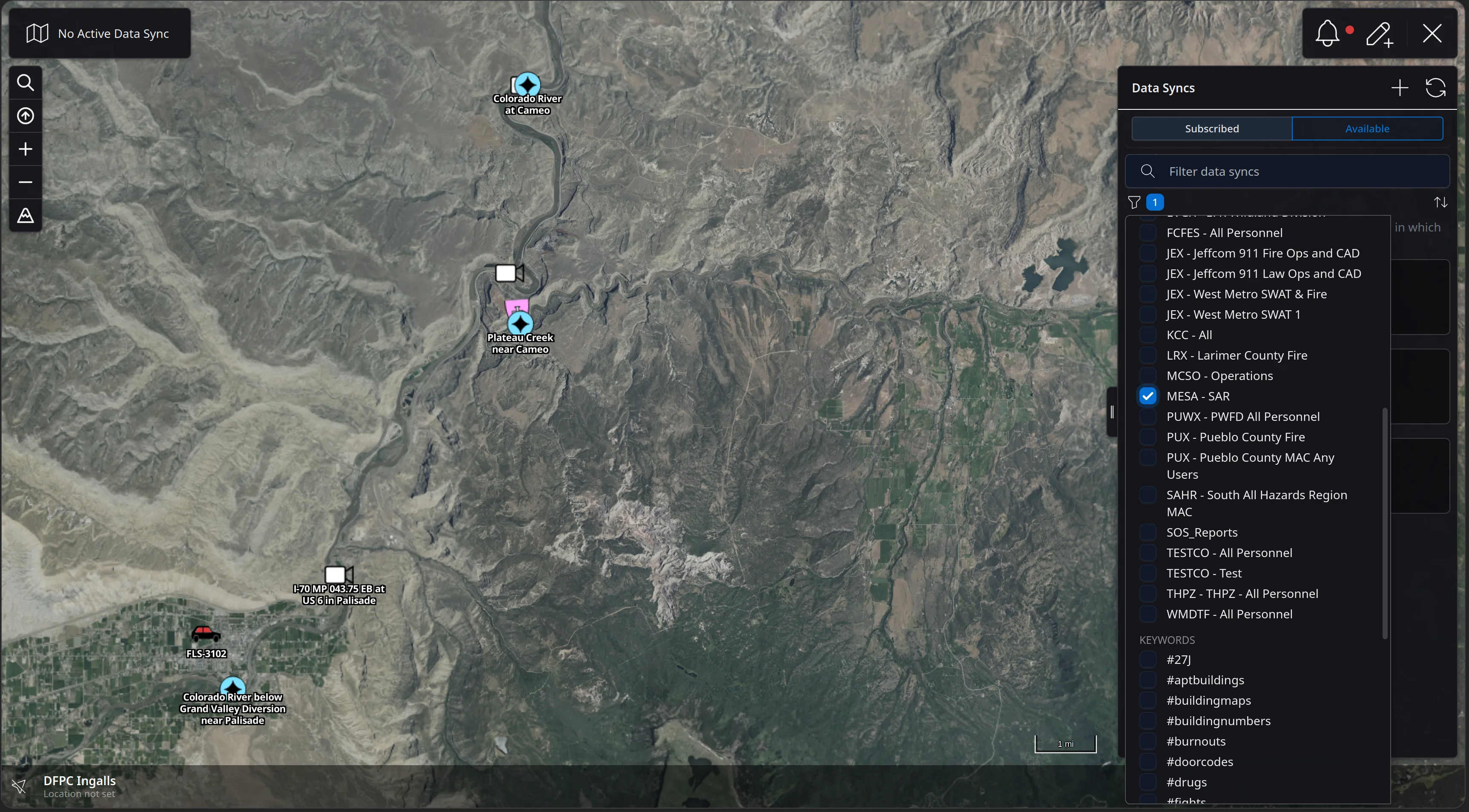 The Data Syncs panel with its filter dropdown open, listing channels such as FCFES, JEX Jeffcom 911 Fire Ops and CAD, LRX Larimer County Fire, MCSO Operations and MESA - SAR, with MESA - SAR checked, and a KEYWORDS section below listing tags such as #buildingmaps and #doorcodes.